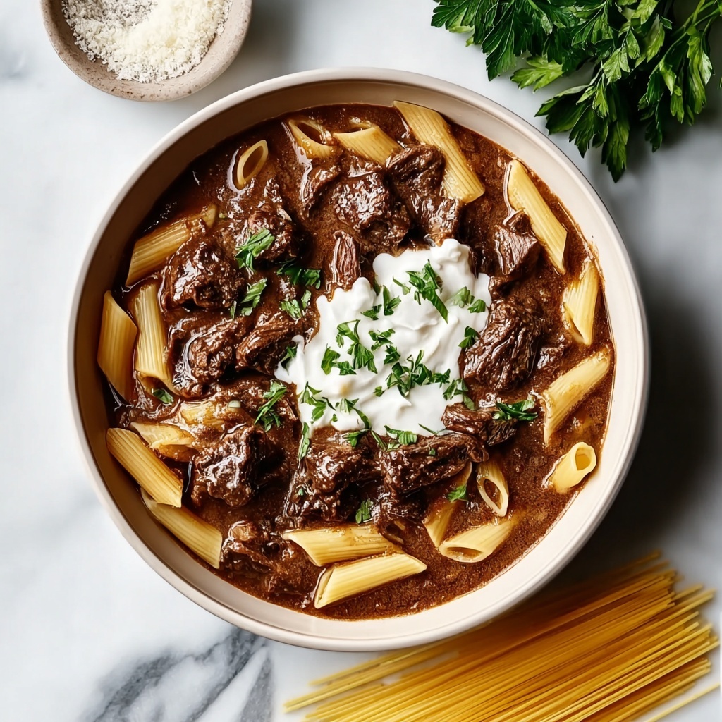 Slow Cooker Creamy Garlic Beef Pasta Recipe - Recipe Image