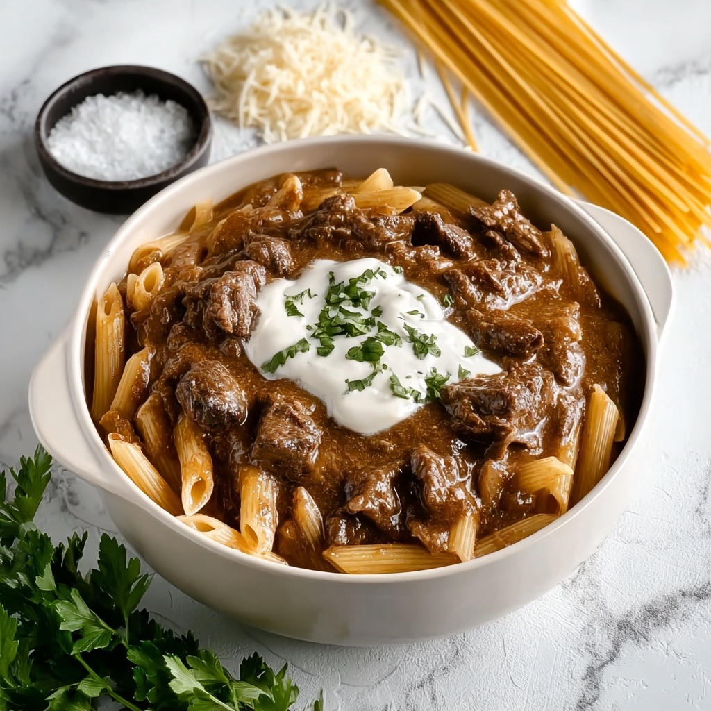 Slow Cooker Creamy Garlic Beef Pasta Recipe - Recipe Image